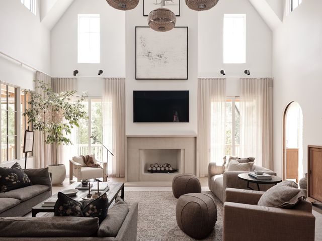 a living room with furniture fireplace and window