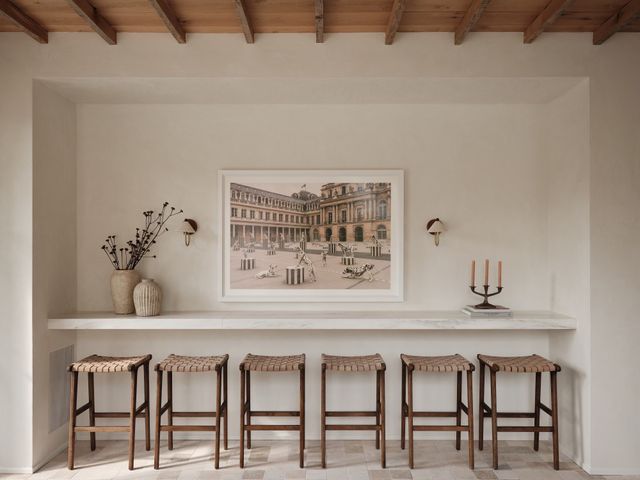 a dining room with a table and chairs