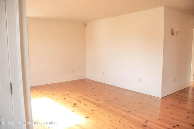 a bathroom with a sink a mirror and a shower