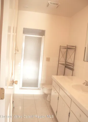 a bathroom with a sink a toilet and tub