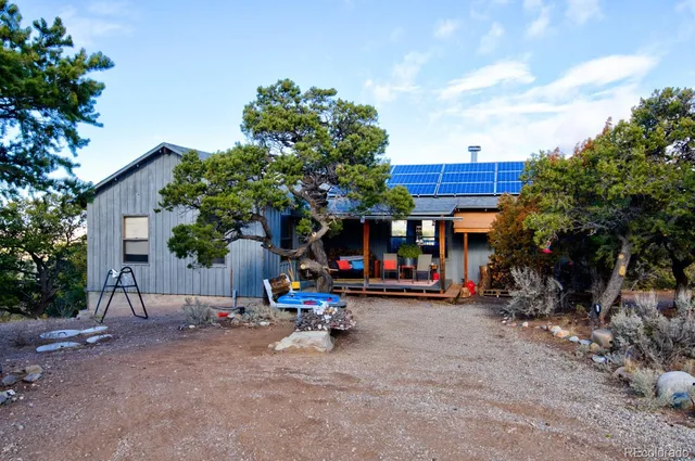 a view of a chairs in front of a house