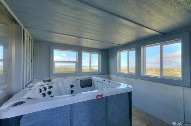 a view of balcony with furniture