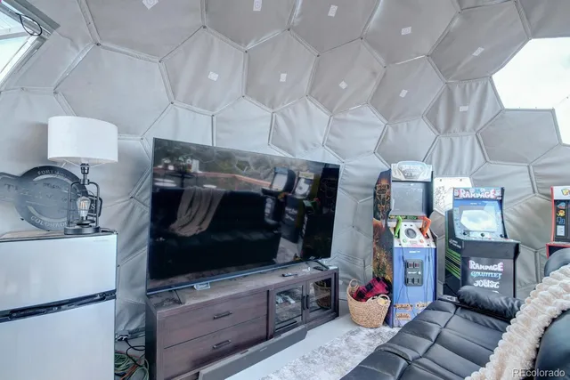a view of a patio with table and chairs potted plants with wooden floor