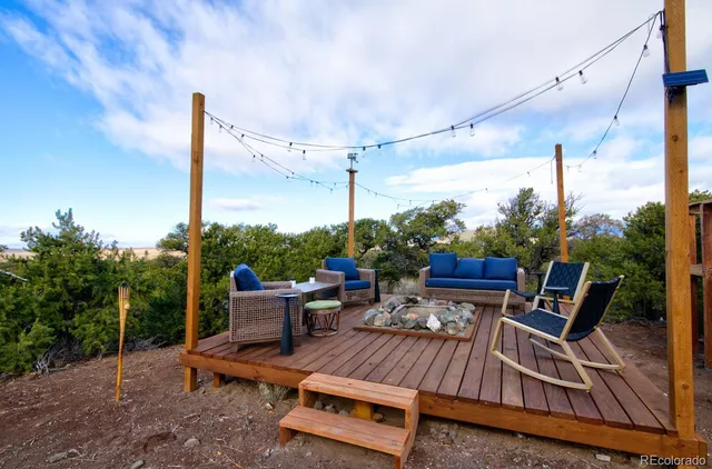 a view of a house with a tree and plants