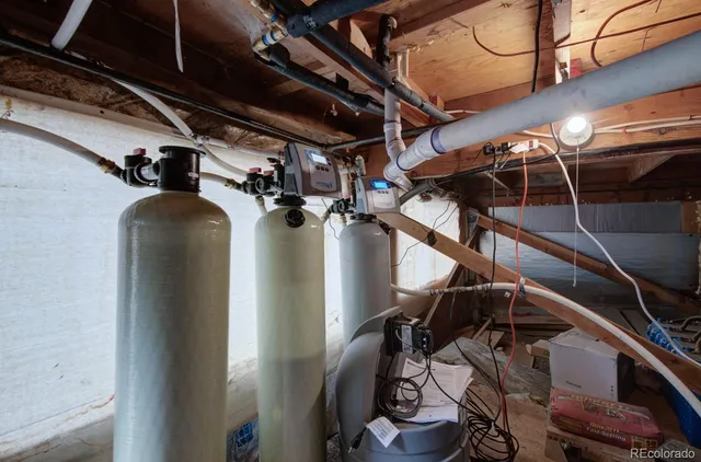an aerial view of house with yard and mountain view in back