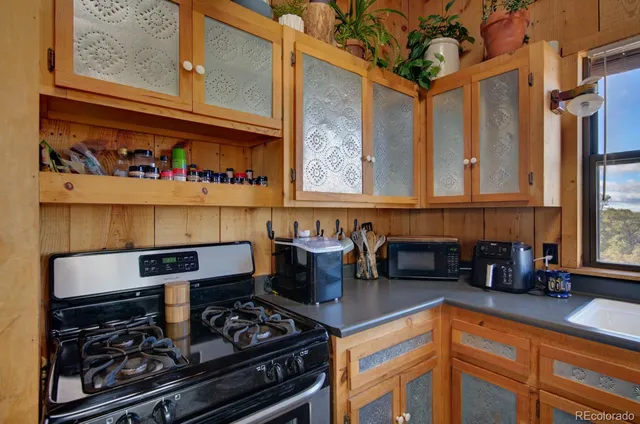 a kitchen with a stove and a refrigerator