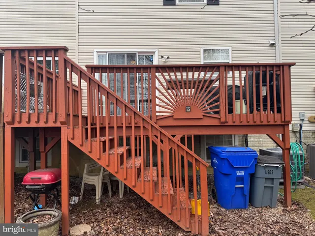 a view of a balcony with furniture and wooden floor