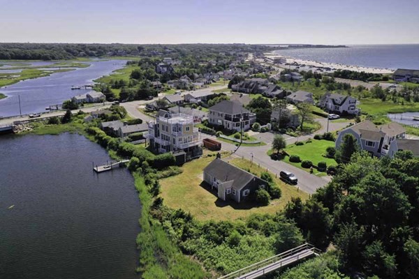 34 Short Beach Road Barnstable, MA 02632 - Photo 1 of 8 an aerial view of a house with a lake view