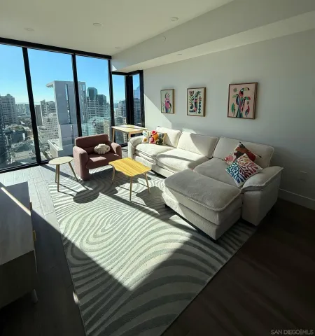 a bedroom with double bed and a large window