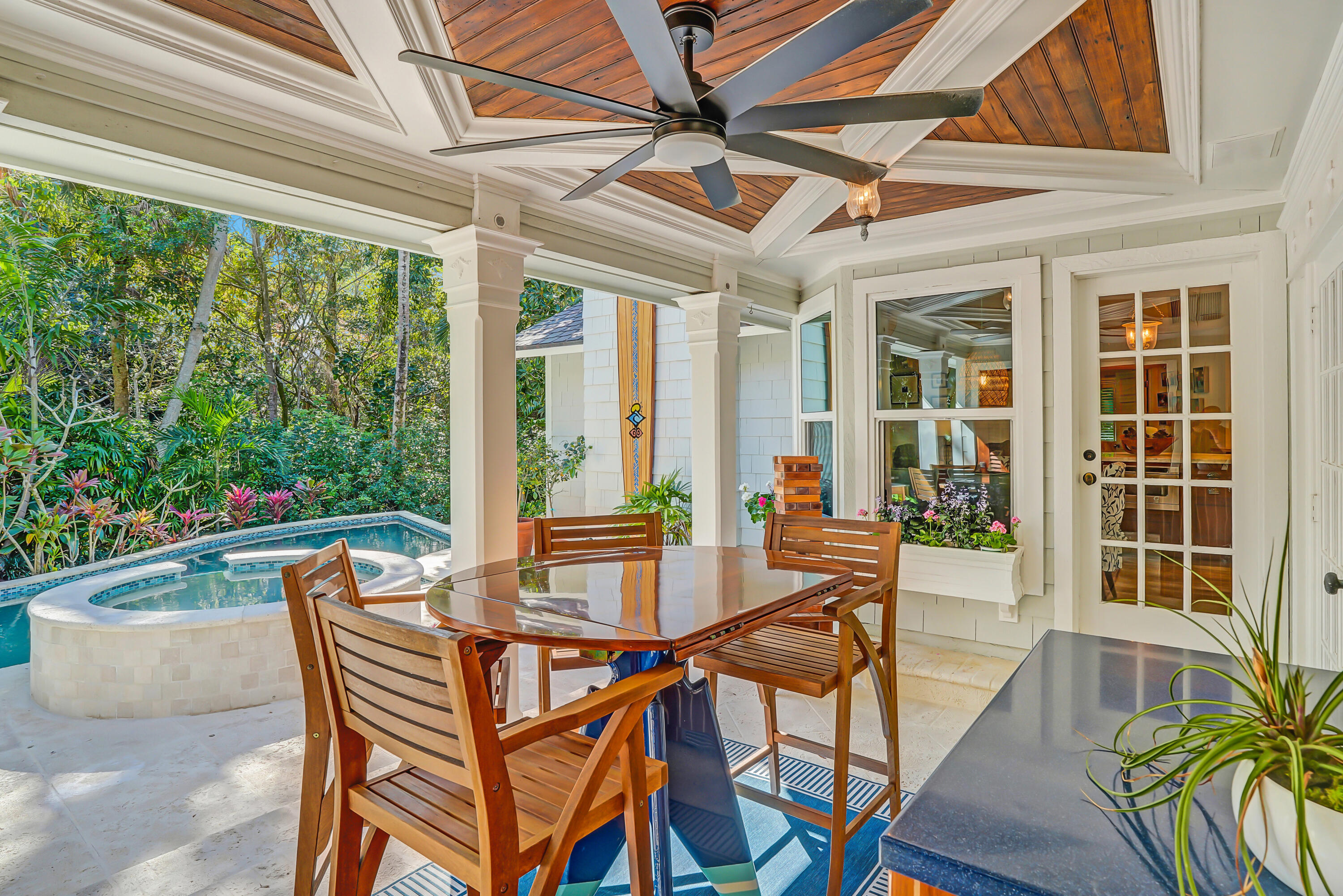6000 Eagles Nest Drive Jupiter, FL 33458 - Photo 37 of 86 a outdoor dining space with a table and chairs