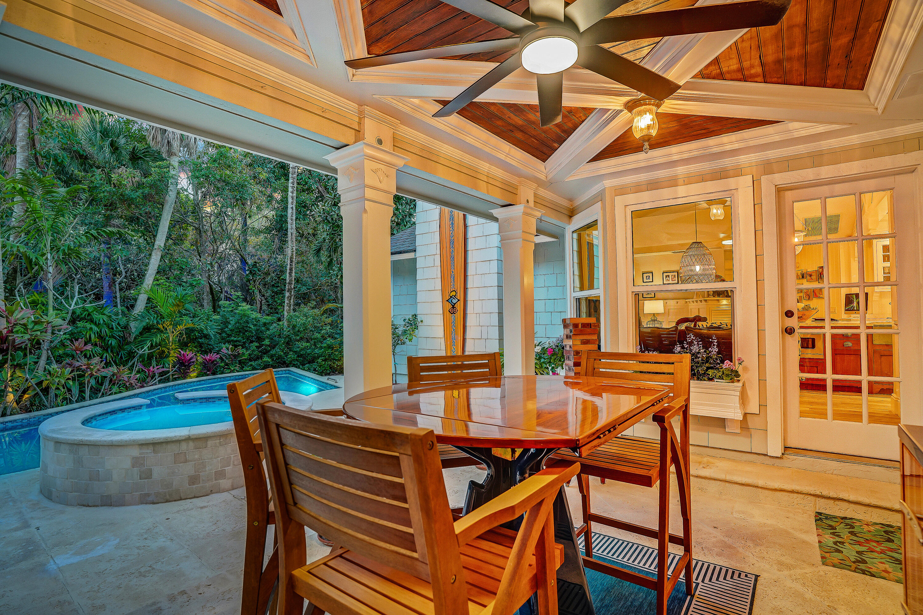 6000 Eagles Nest Drive Jupiter, FL 33458 - Photo 48 of 86 a view of a dining room with furniture large windows and wooden floor