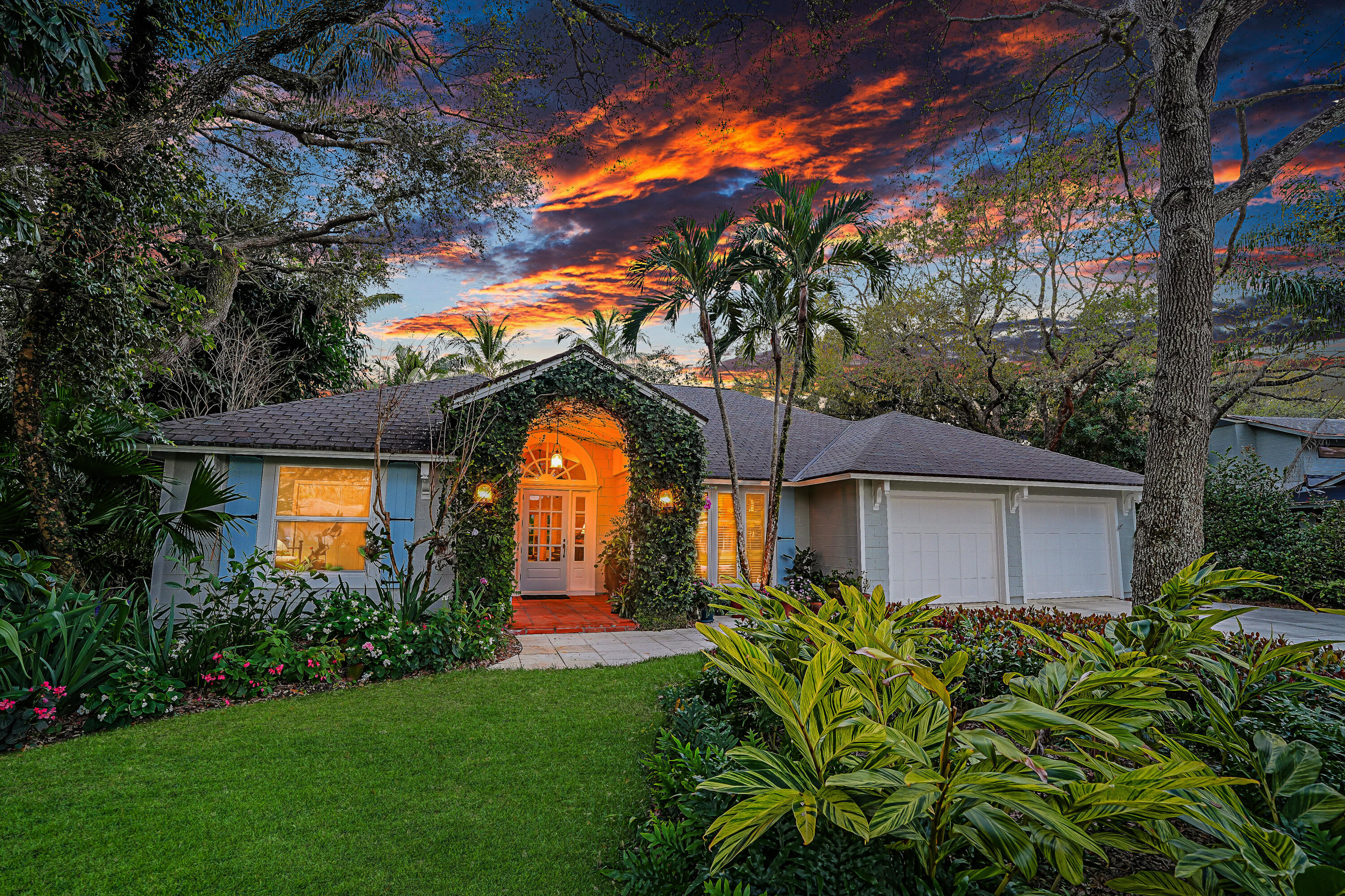 6000 Eagles Nest Drive Jupiter, FL 33458 - Photo 53 of 86 a front view of house with a garden