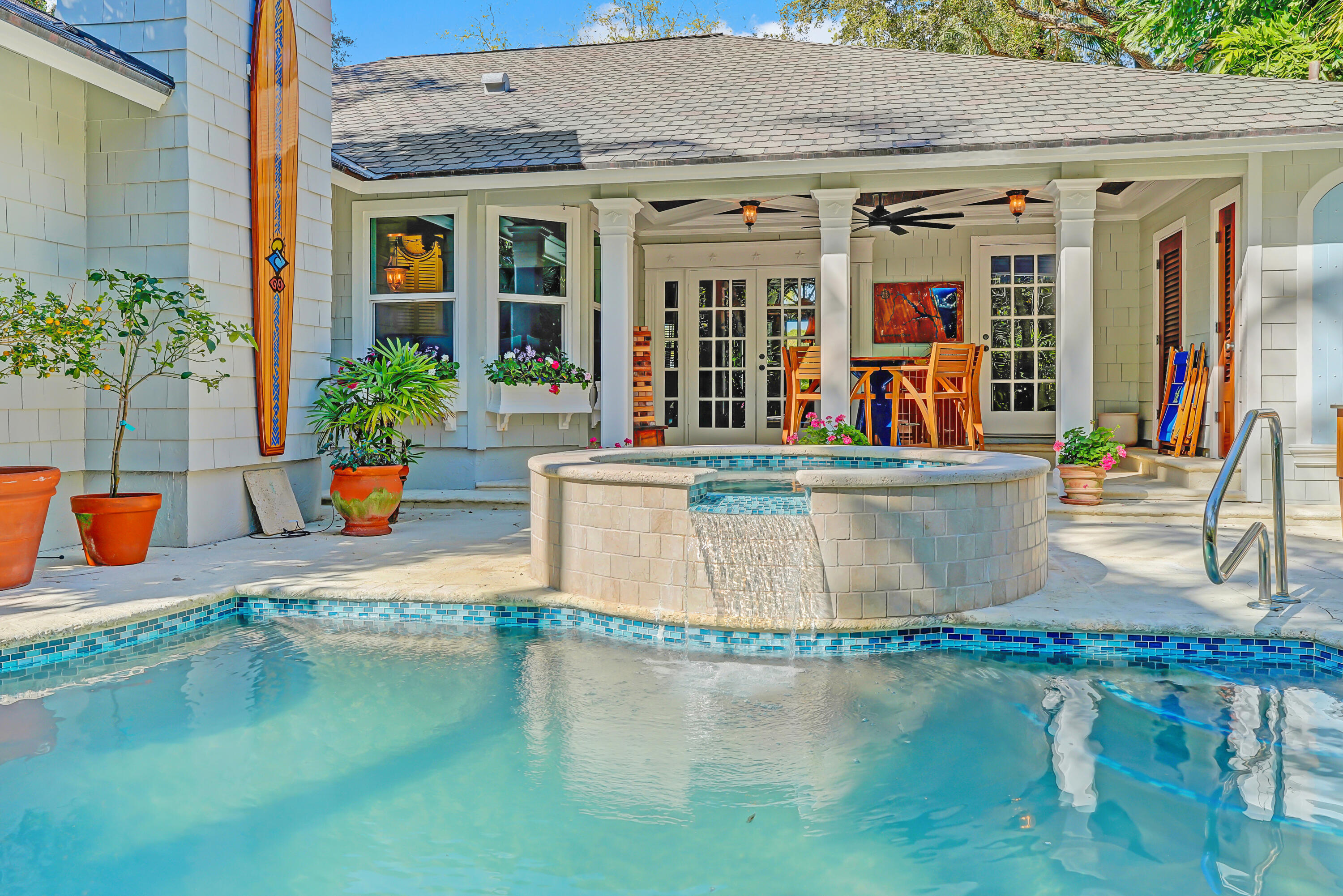 6000 Eagles Nest Drive Jupiter, FL 33458 - Photo 59 of 86 a view of a swimming pool with an outdoor seating