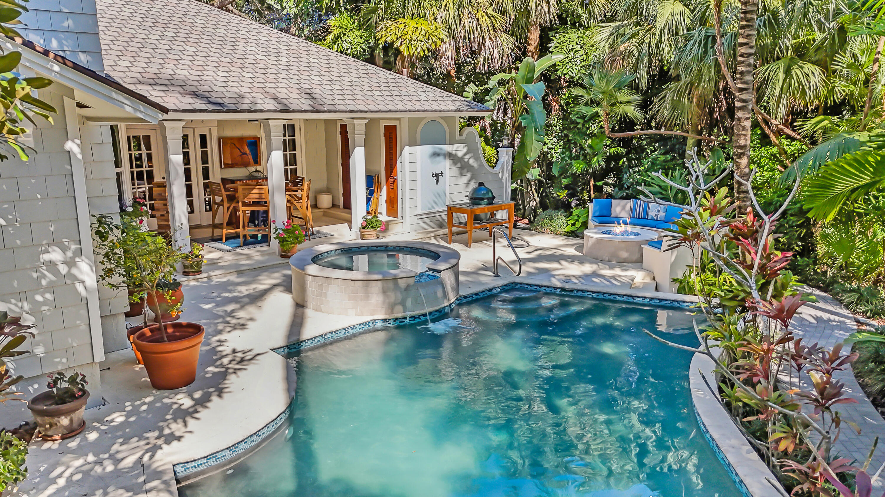 6000 Eagles Nest Drive Jupiter, FL 33458 - Photo 61 of 86 a view of a house with pool and chairs