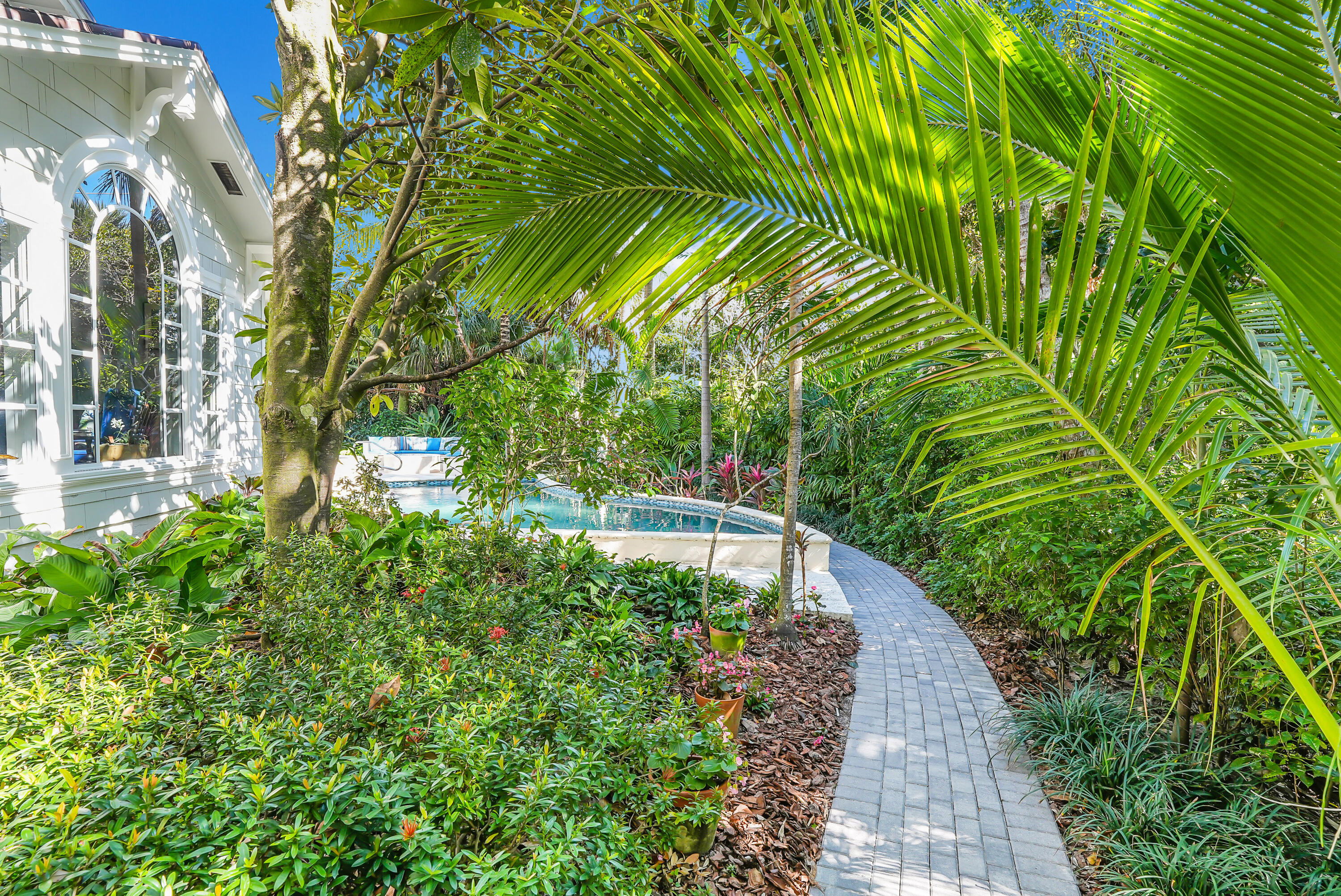 6000 Eagles Nest Drive Jupiter, FL 33458 - Photo 68 of 86 a view of a yard with plants and large trees