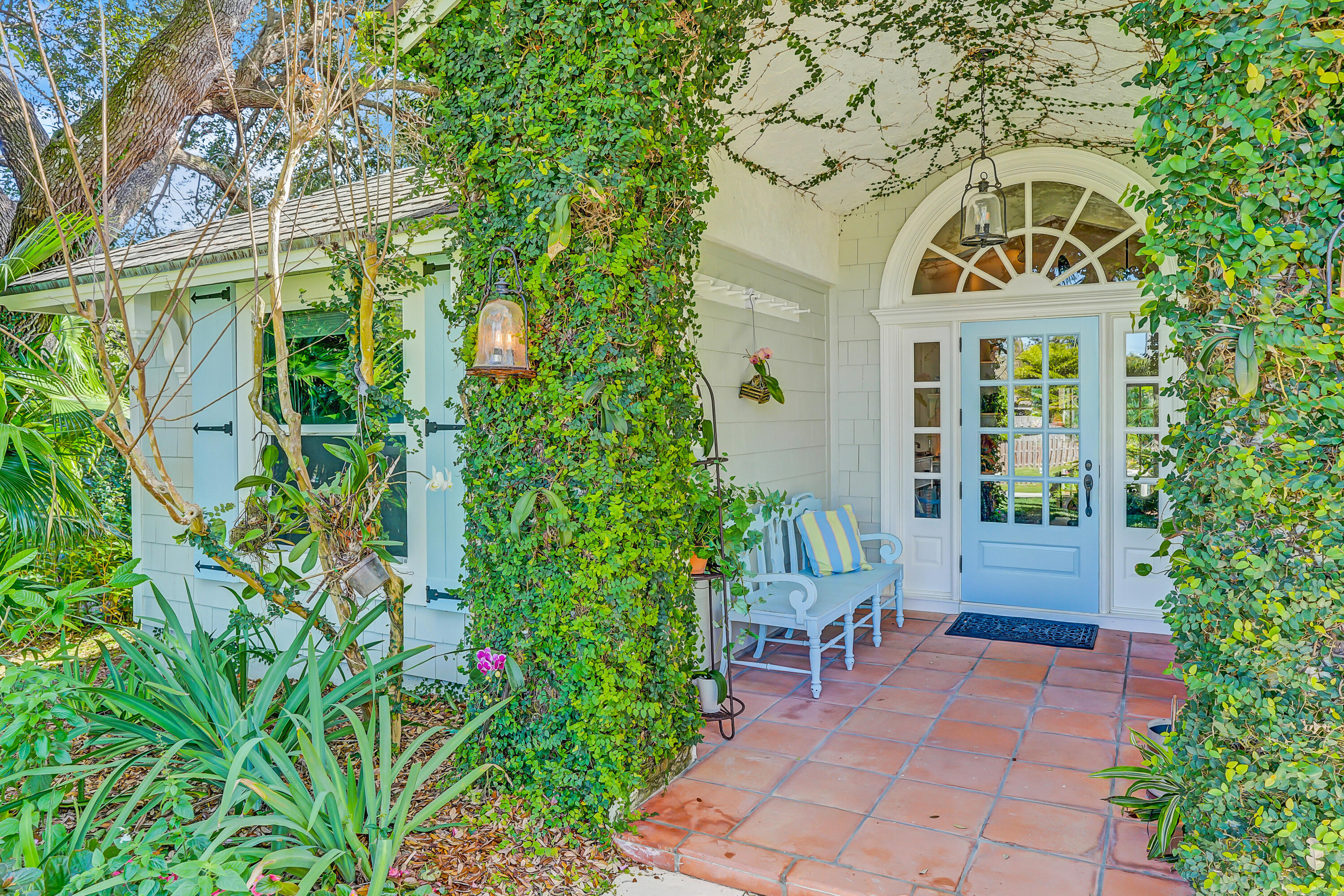 6000 Eagles Nest Drive Jupiter, FL 33458 - Photo 8 of 86 a front view of a house with a garden
