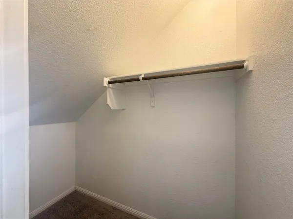 an open kitchen with kitchen island white cabinets and stainless steel appliances
