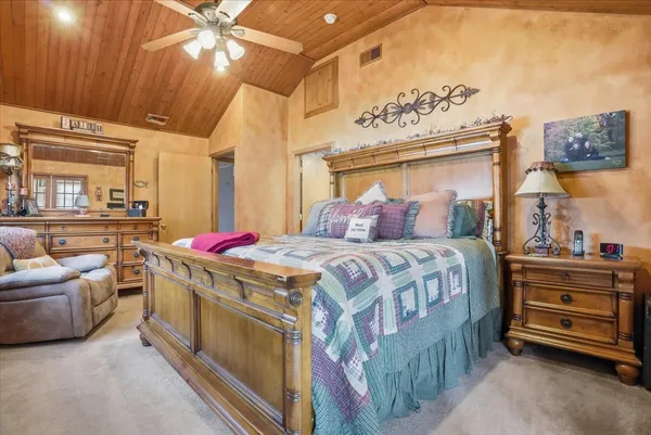 a bedroom with a bed and a couch