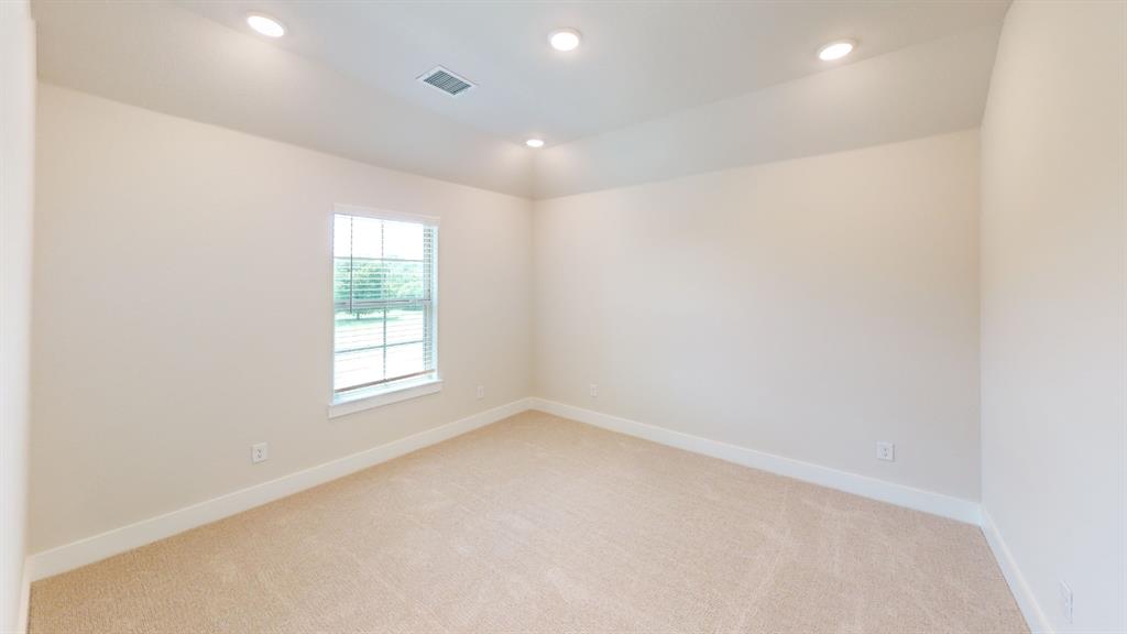 2708 Andesite Road McKinney, TX 75071 - Photo 17 of 35 Neutral-toned room featuring a single window with horizontal blinds, recessed ceiling lighting, and light-colored carpeting