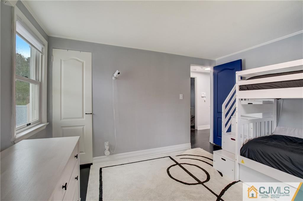 49 West Cliff Road Colonia, NJ 07067 - Photo 11 of 33 a bedroom with a bed and a window