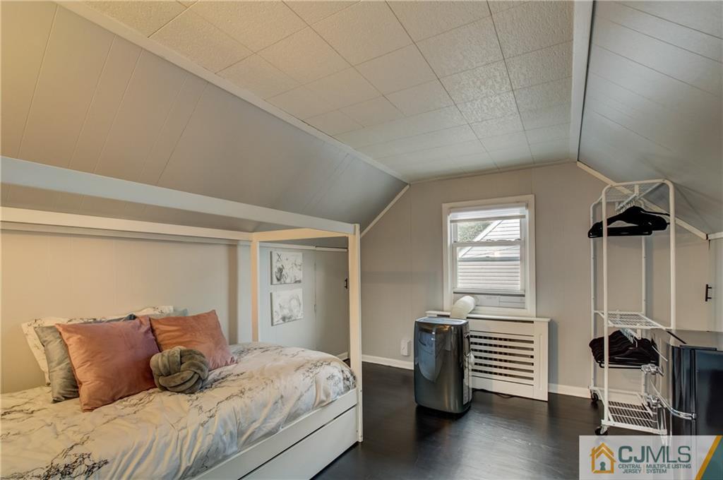49 West Cliff Road Colonia, NJ 07067 - Photo 17 of 33 a bedroom with a bed and a window