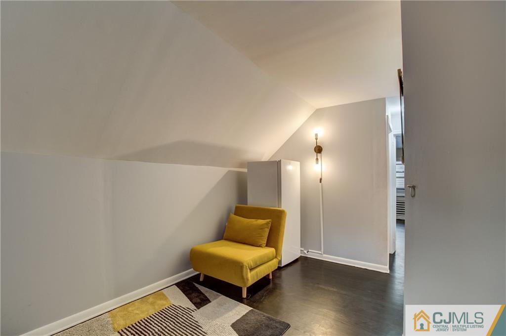 49 West Cliff Road Colonia, NJ 07067 - Photo 23 of 33 a view of a livingroom with furniture and wooden floor