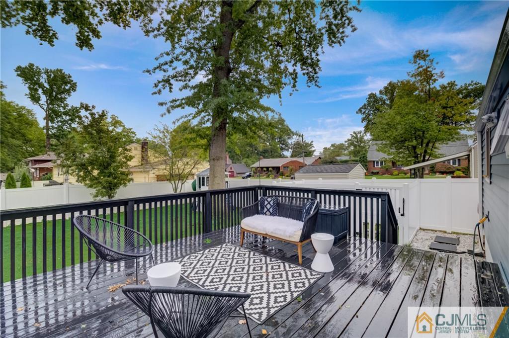 49 West Cliff Road Colonia, NJ 07067 - Photo 25 of 33 a view of balcony with wooden floor and outdoor seating