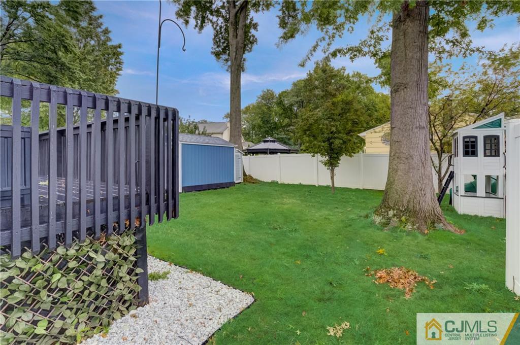 49 West Cliff Road Colonia, NJ 07067 - Photo 29 of 33 a view of a backyard with a tree