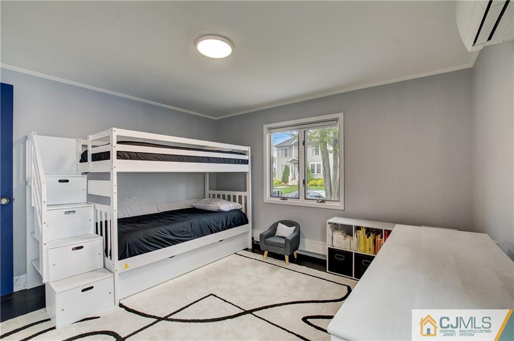 49 West Cliff Road Colonia, NJ 07067 - Photo 10 of 33 a bedroom with furniture and a window
