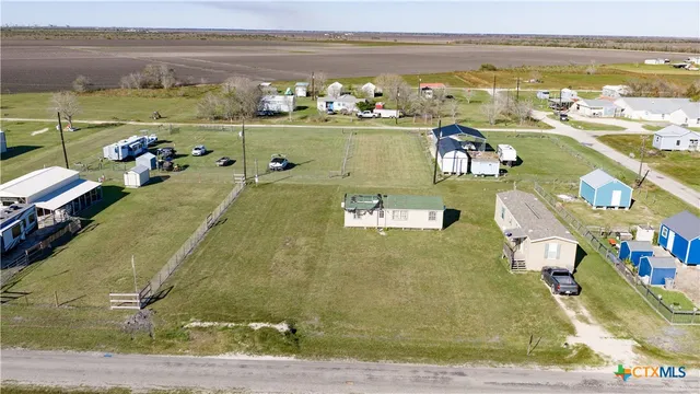 an aerial view of a house with a ocean view