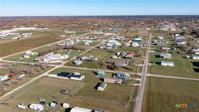 an aerial view of a house with a swimming pool