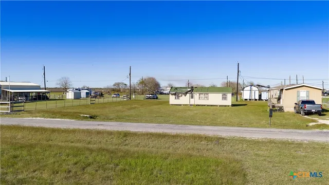 a view of a house with a big yard
