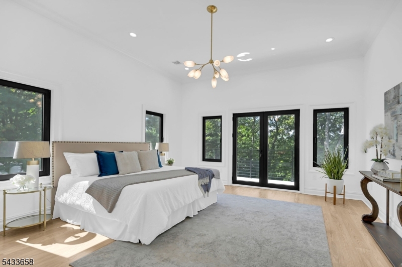 2 Orchard Road Florham Park, NJ 07932 - Photo 19 of 23 a bed room with a bed and a chandelier
