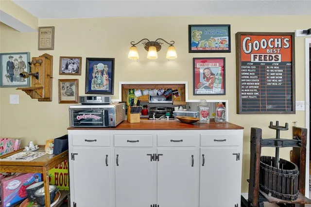 a view of a livingroom with furniture and floor to ceiling window