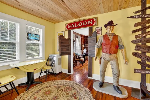 a bathroom with a toilet a sink and a mirror