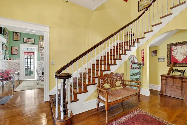a view of a dining room with furniture large window and wooden floor