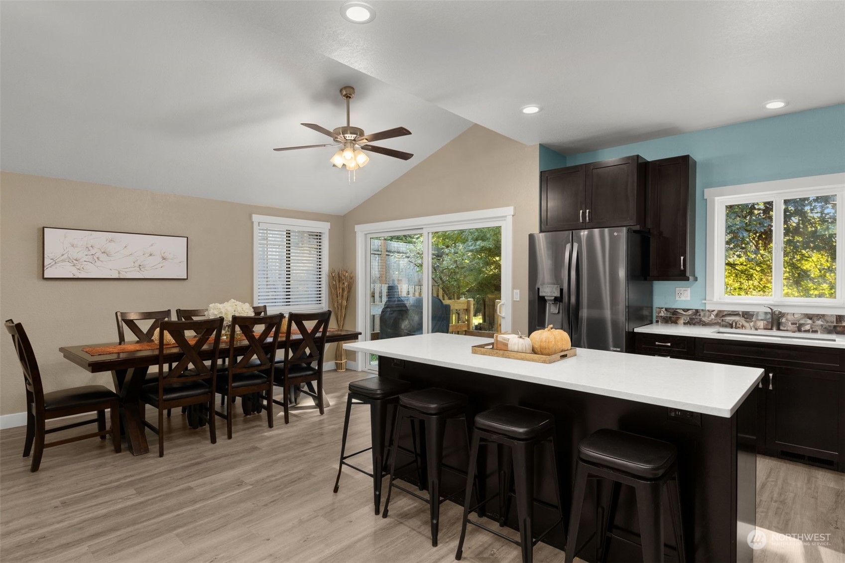 17547 Southeast 135th Street Renton, WA 98059 - Photo 13 of 37 a view of a dining room with furniture window and wooden floor