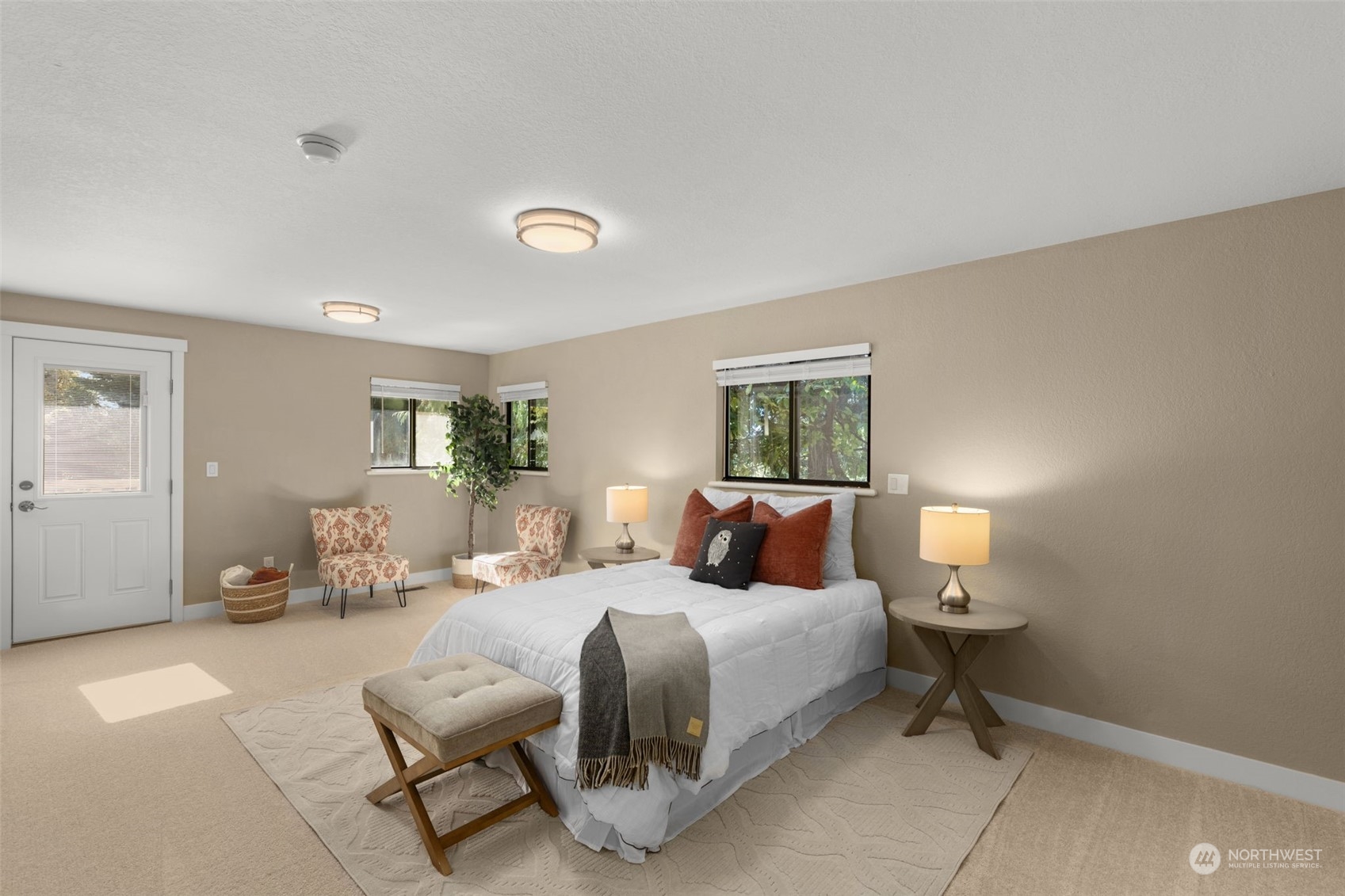 17547 Southeast 135th Street Renton, WA 98059 - Photo 17 of 37 a bedroom with a bed and wooden floor