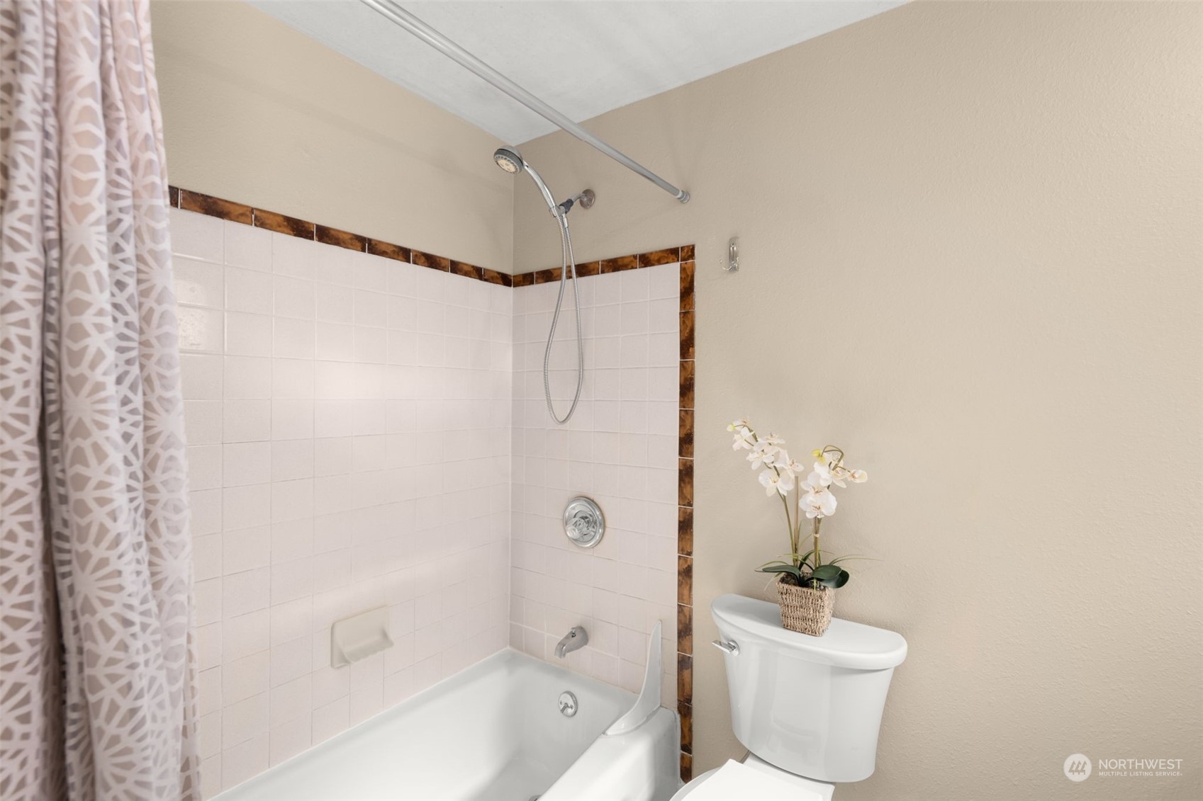 17547 Southeast 135th Street Renton, WA 98059 - Photo 21 of 37 a bath room with a toilet and a shower curtain