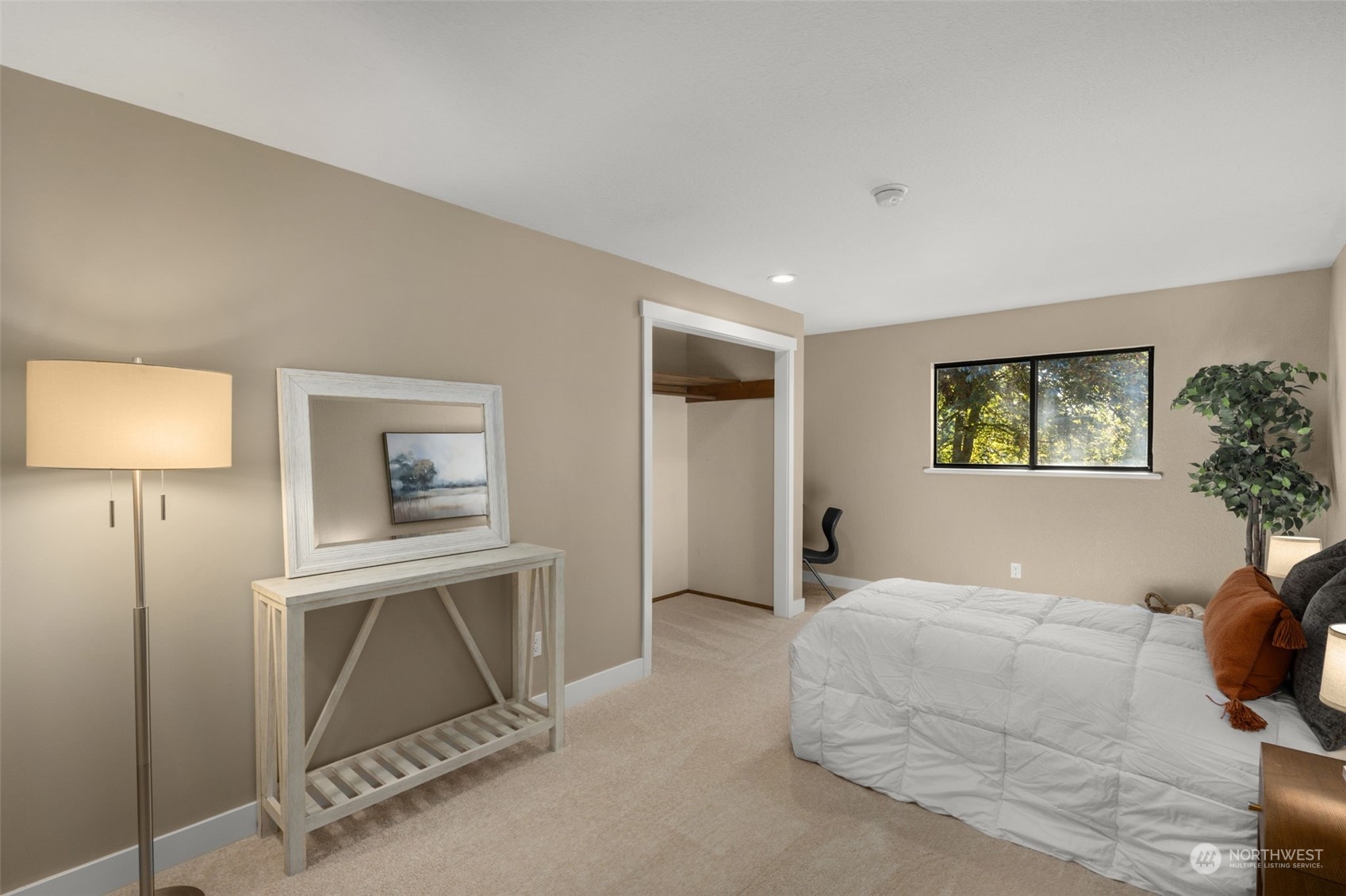 17547 Southeast 135th Street Renton, WA 98059 - Photo 22 of 37 a bedroom with a bed and a painting on the wall