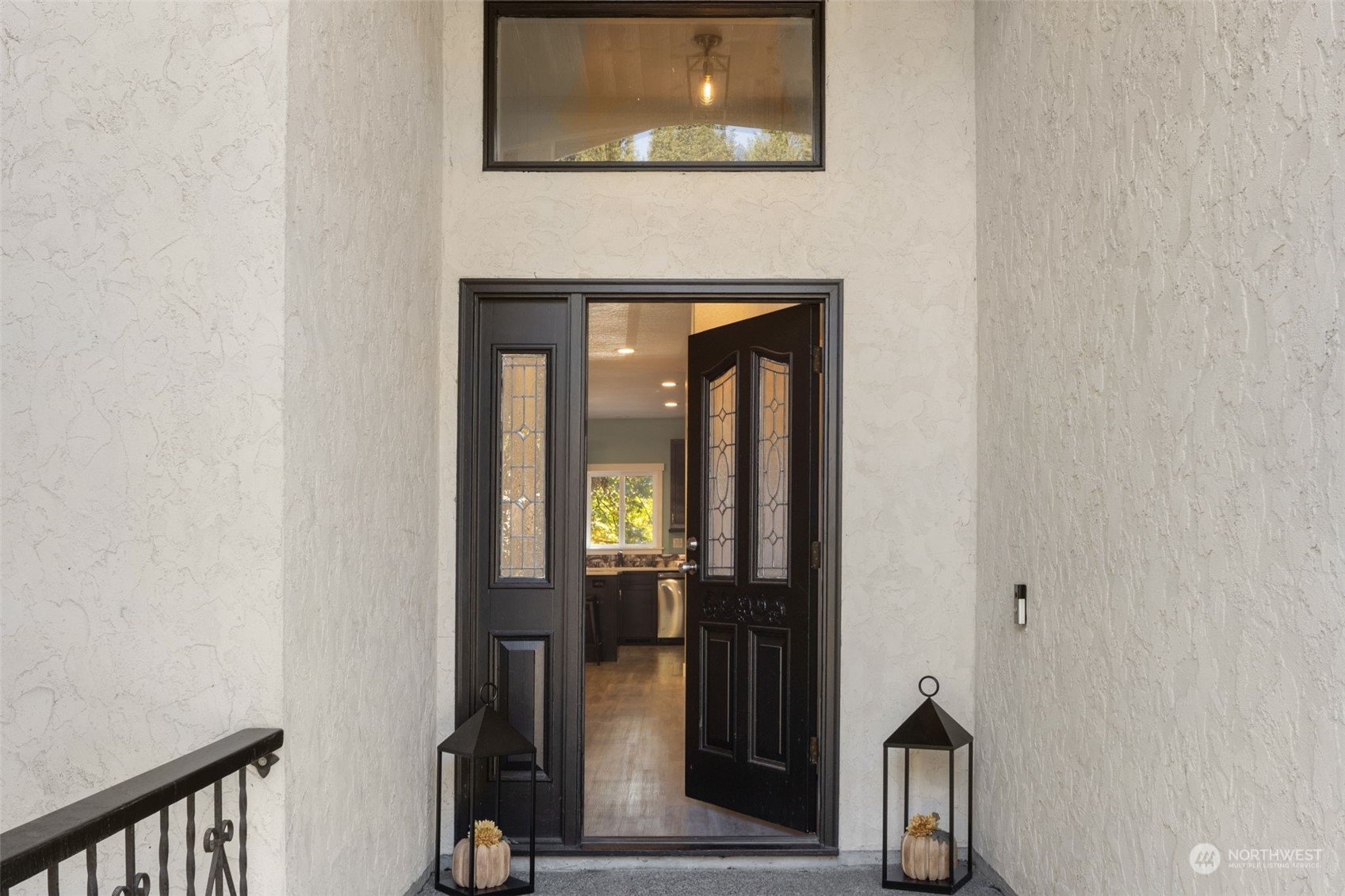 17547 Southeast 135th Street Renton, WA 98059 - Photo 3 of 37 a living room with a mirror and a wooden floor