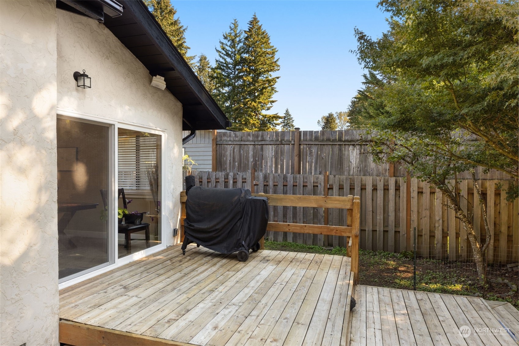 17547 Southeast 135th Street Renton, WA 98059 - Photo 31 of 37 a view of deck with wooden floor and outdoor seating