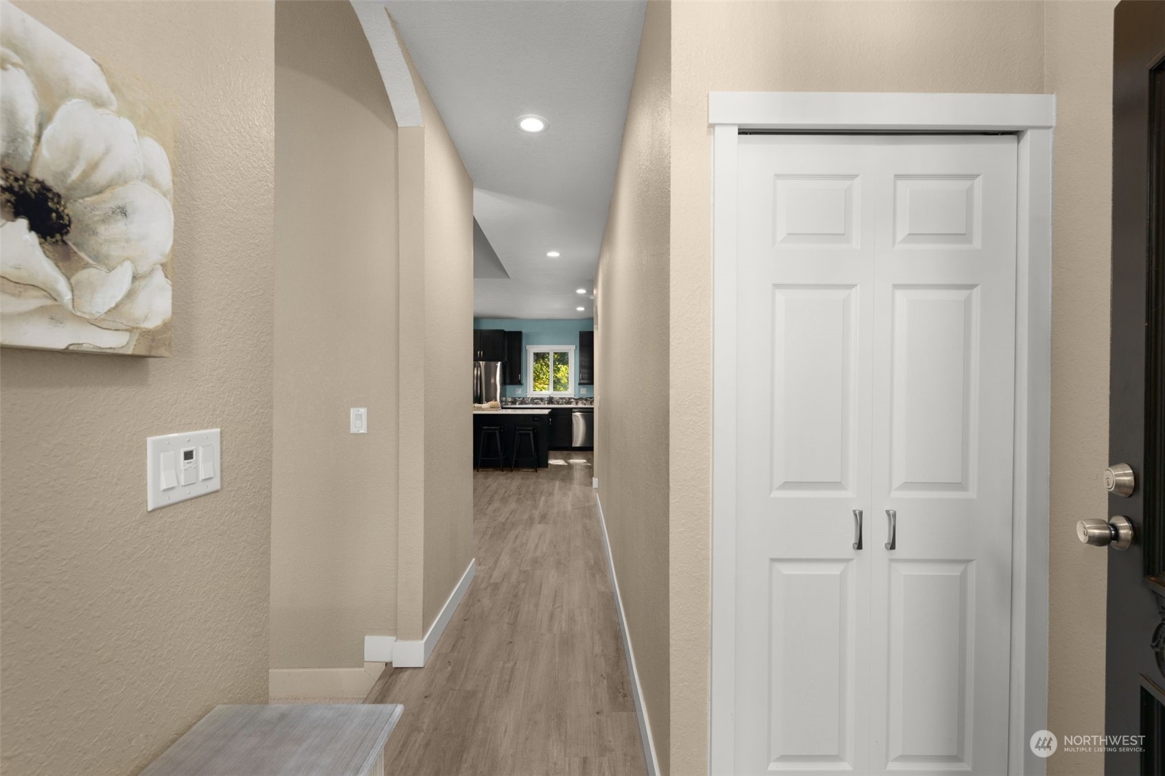 17547 Southeast 135th Street Renton, WA 98059 - Photo 4 of 37 a view of a hallway with wooden floor windows and a livingroom