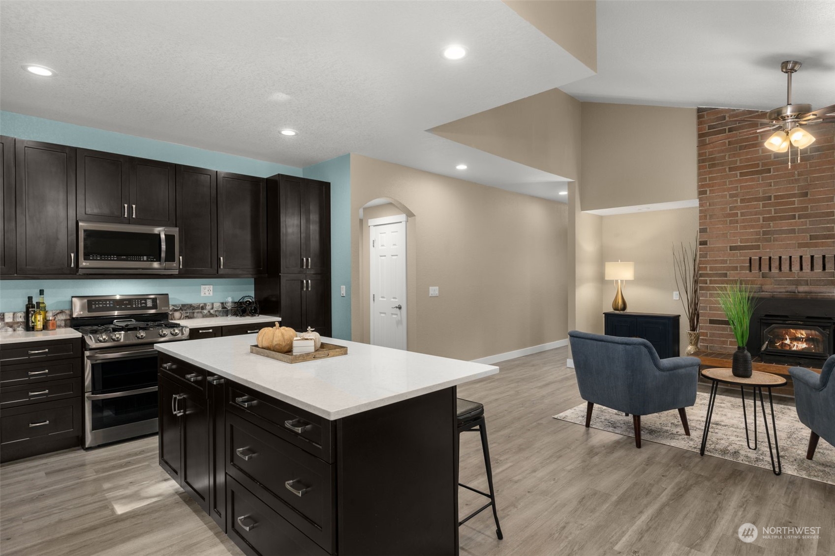 17547 Southeast 135th Street Renton, WA 98059 - Photo 8 of 37 a kitchen with a cabinets appliances and a dining table