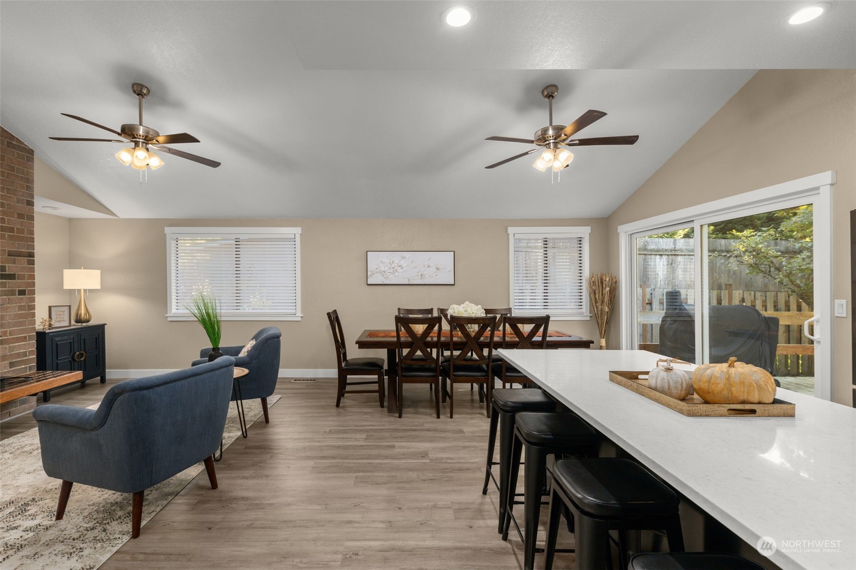 17547 Southeast 135th Street Renton, WA 98059 - Photo 9 of 37 a view of a dining room with furniture window and wooden floor