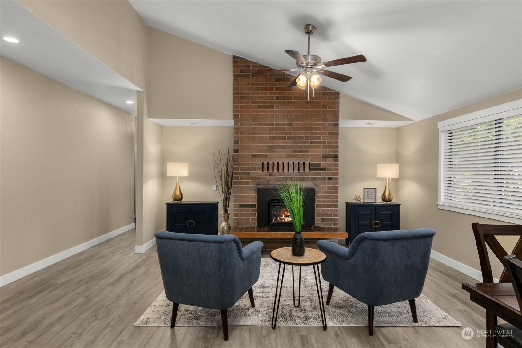 17547 Southeast 135th Street Renton, WA 98059 - Photo 10 of 37 a living room with furniture and a fireplace