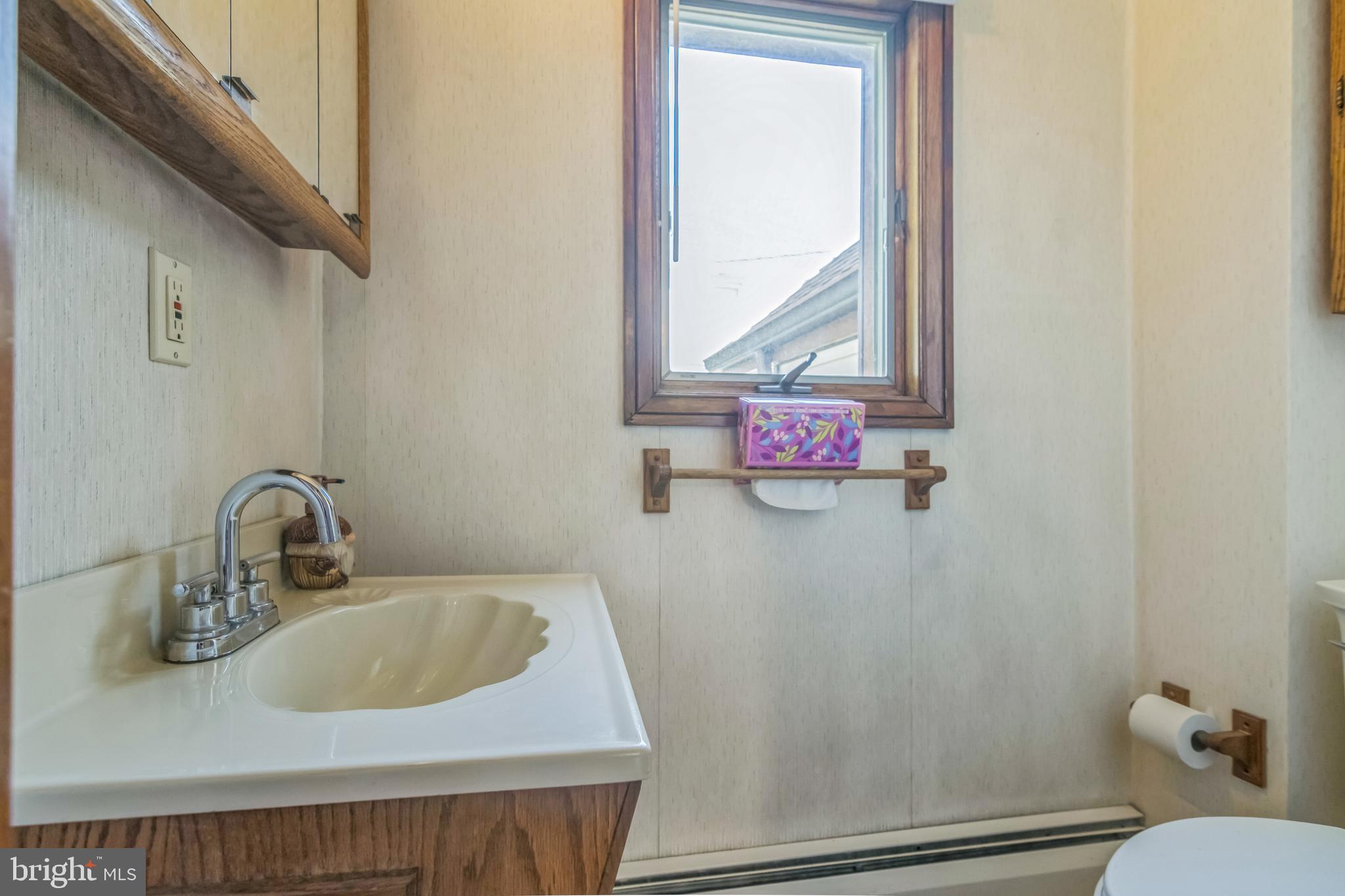 361 Amosland Road Holmes, PA 19043 - Photo 20 of 30 a bathroom with a sink and a mirror