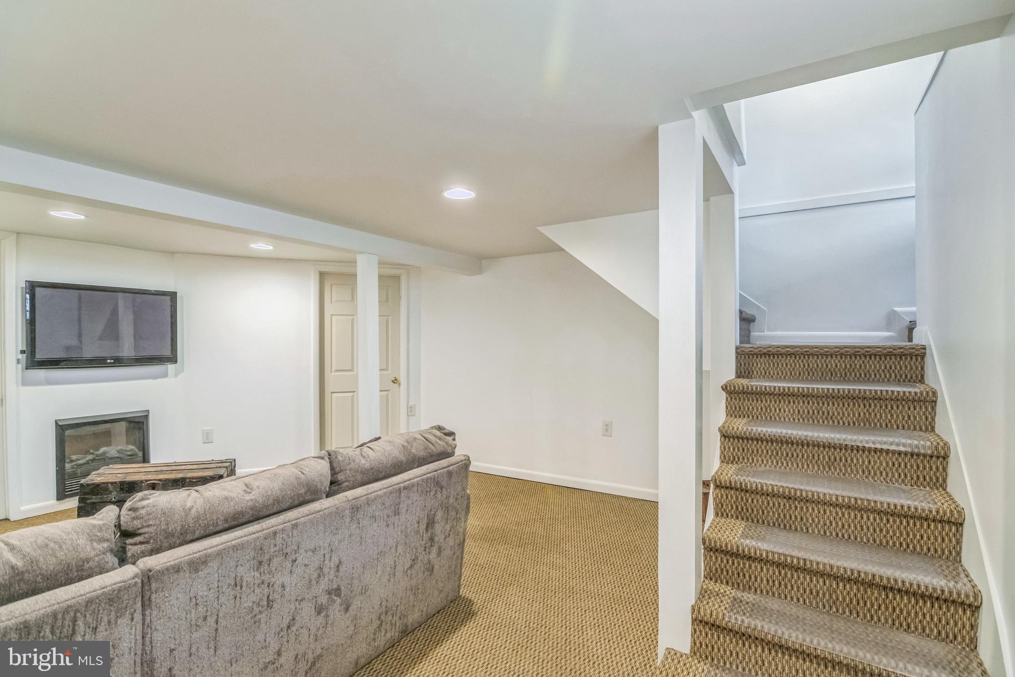 361 Amosland Road Holmes, PA 19043 - Photo 28 of 30 a living room with furniture and a fireplace