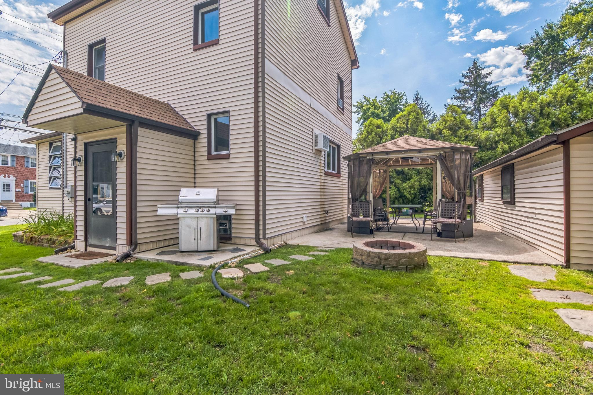361 Amosland Road Holmes, PA 19043 - Photo 5 of 30 a view of a chair and table in backyard of the house