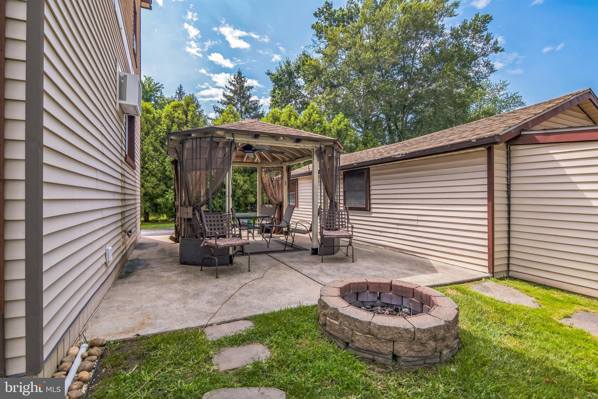 361 Amosland Road Holmes, PA 19043 - Photo 7 of 30 a view of a chair and table in backyard of the house
